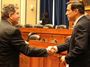 Postmaster Patrick Donahoe and California Rep. Darrell Issa, R-Ca., shake hands after an oversight hearing on the future of the Postal Service. (John Burfisher/MNS