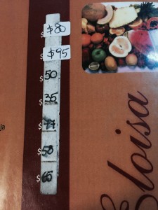 On a drink menu of a Buenos Aires cafe, layers of price tags show the highly inflated prices. (Photo by Lei Xuan / Medill)