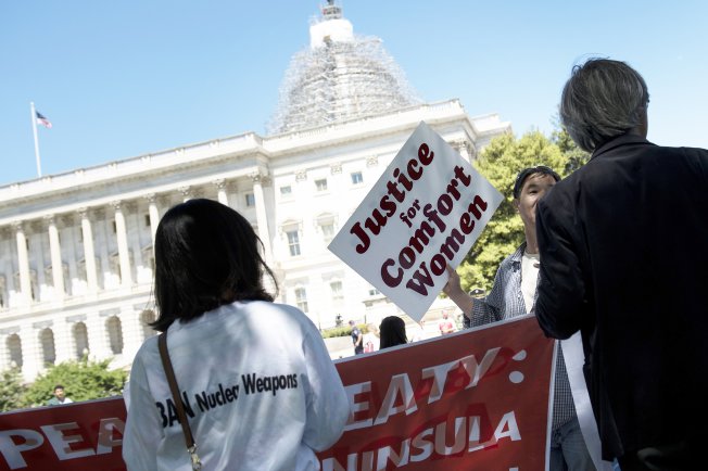 Protesters push Japanese PM Shinzo Abe on plight of WWII ‘Comfort Women’