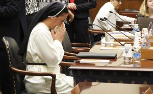 Sister Diana Momeka waits for the hearing to start in order to testify on ISIS attacks on religious minorities. (Medill/Mary Lee)