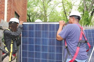 Workers checking solar panels at a home in Northeast Washington, May 3, 2016. (Xiumei Dong/MNS) 