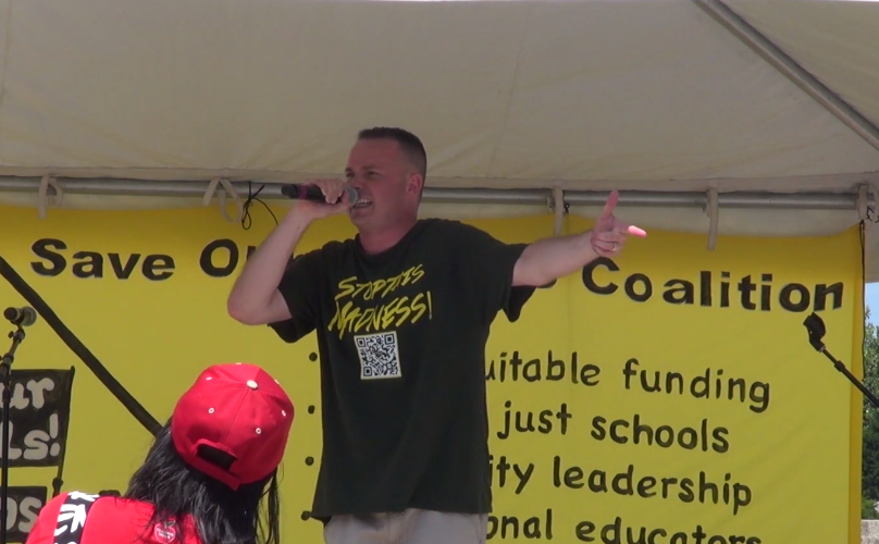 Albany teacher and rapper Jeremy Dudley performs at Washington rally