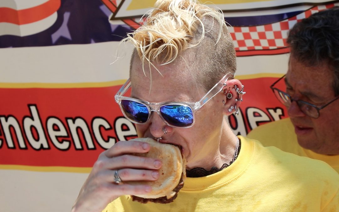Woman eats record 32 burgers in 10 minutes to win Z Burger eating contest