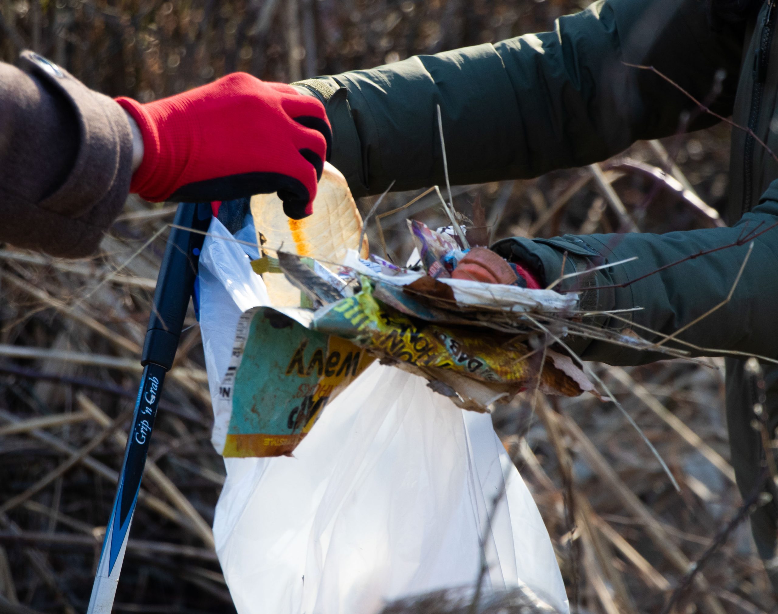 Volunteers pick up trash from the park during the cleanup in honor of Martin Luther King on Saturday.  (Isabel Miller | Medill News Service)