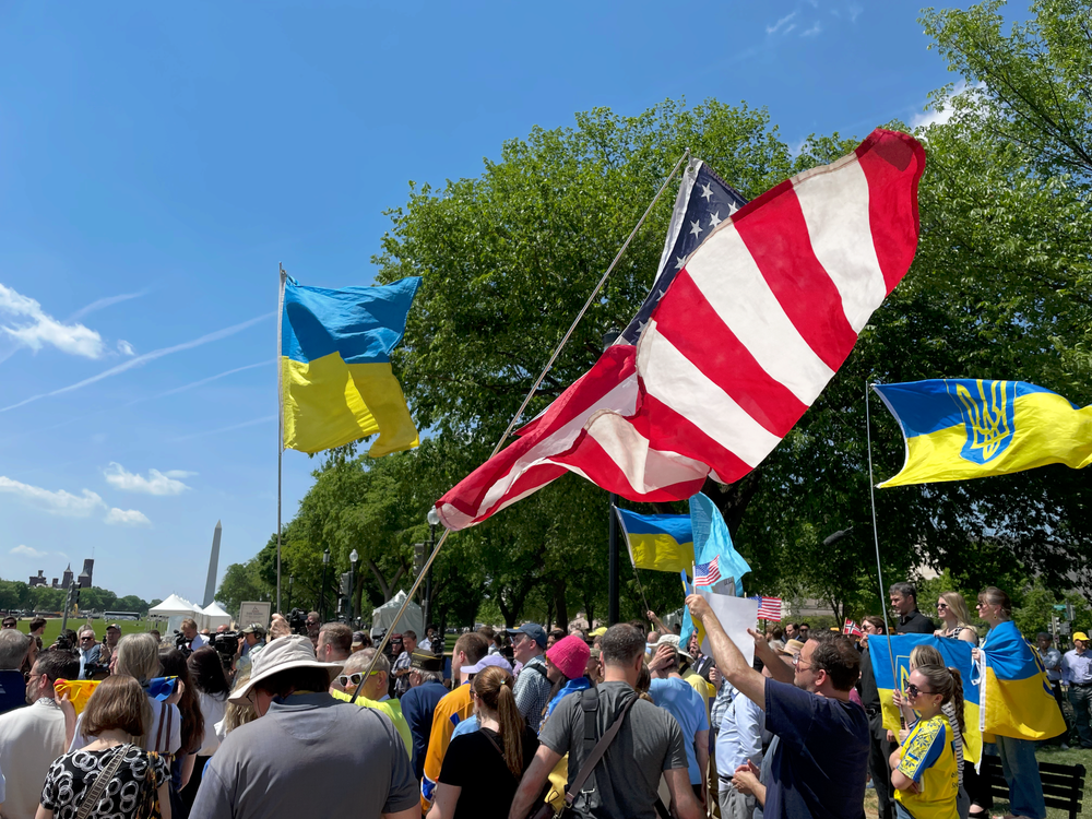 Demonstrators hold Ukrainian and U.S. flags