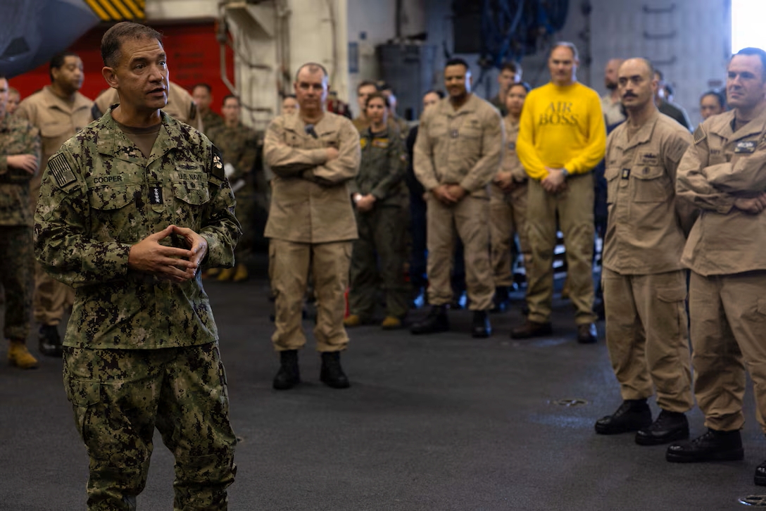 Adm. Cooper with sailors