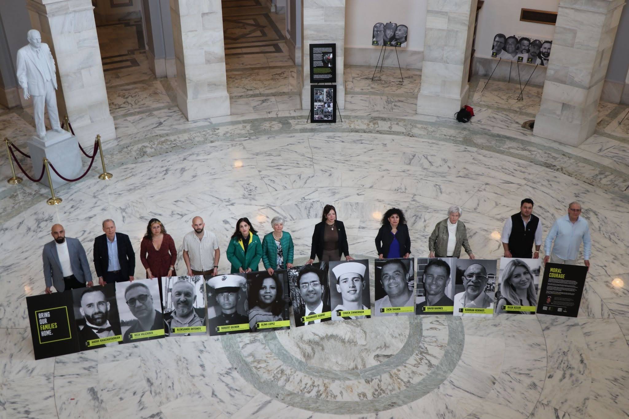 The Bring Our Families Home campaign brought together loved ones of Americans wrongly detained overseas to display portraits in the Senate Russell Rotunda on Wednesday, May 6. (Jacques Abou-Rizk, MNS)