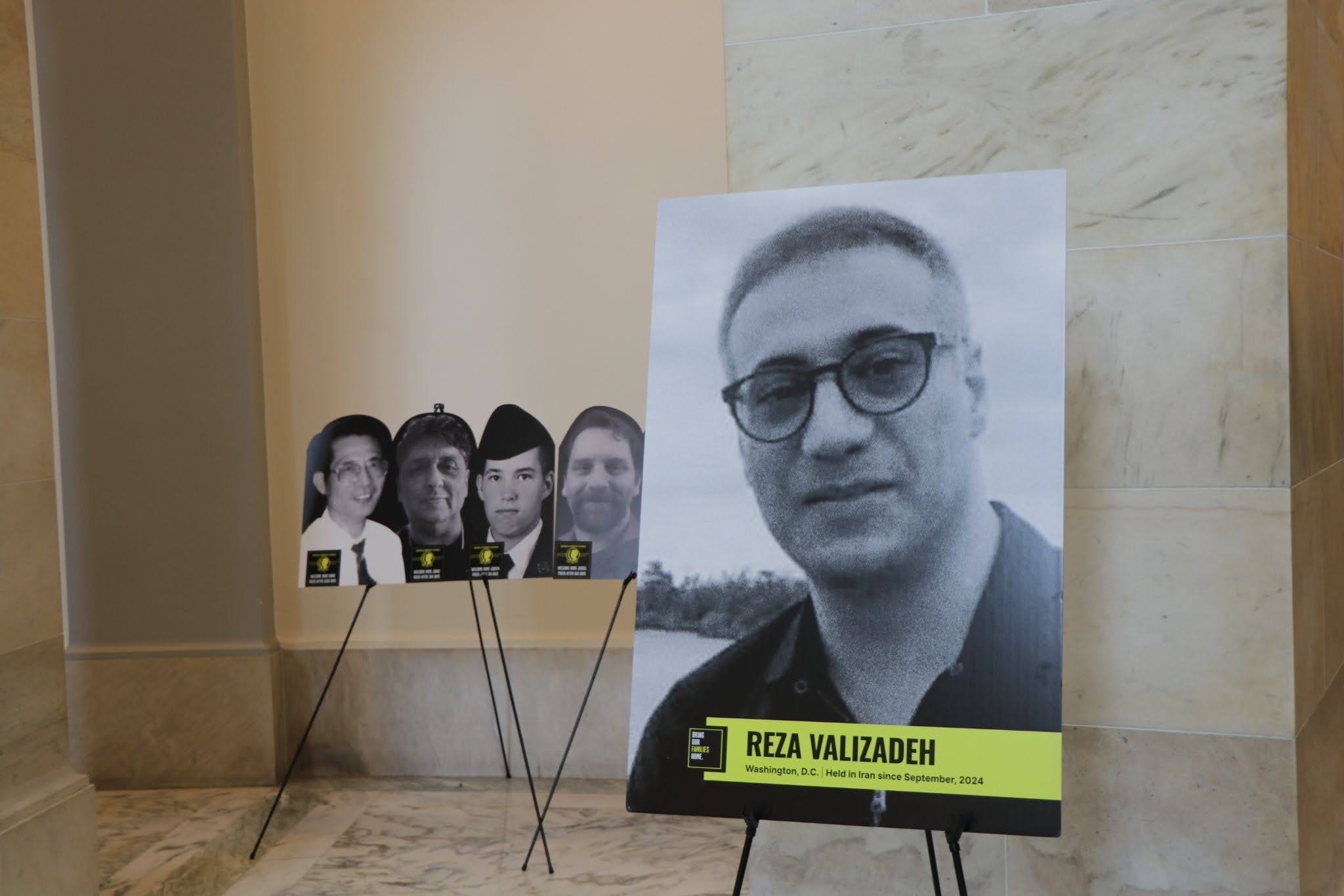 The portrait of Reza Valizadeh stands in the Senate Russell Rotunda in front of images of wrongful American detainees that the Foley Foundation has helped bring home. (Jacques Abou-Rizk, MNS)